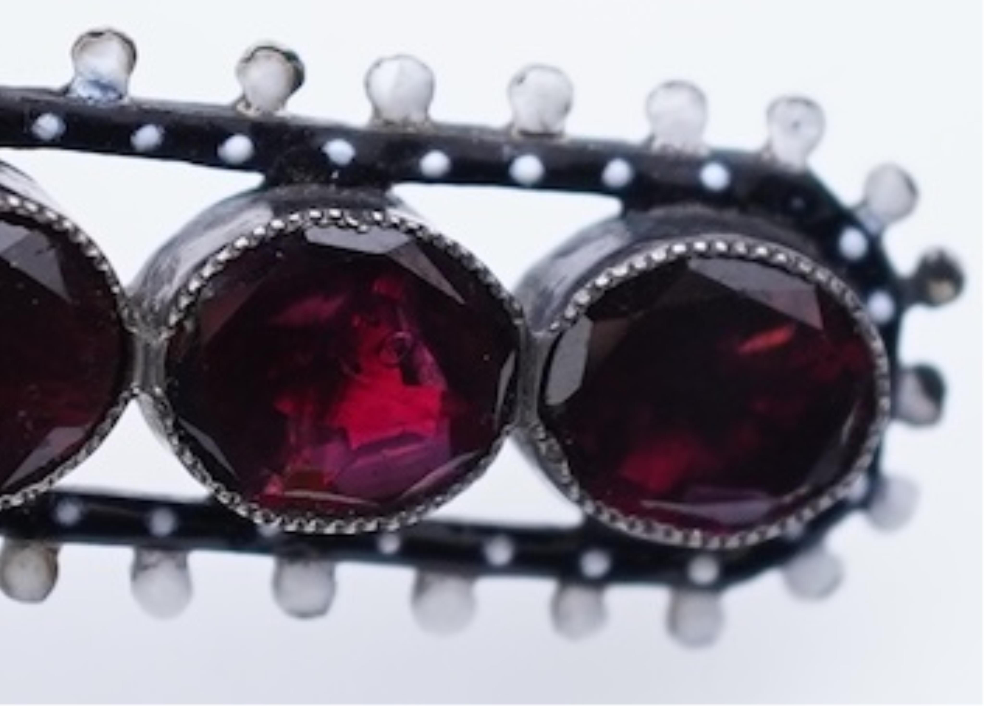 A Renaissance Revival enamel and garnet pendant, late 19th century